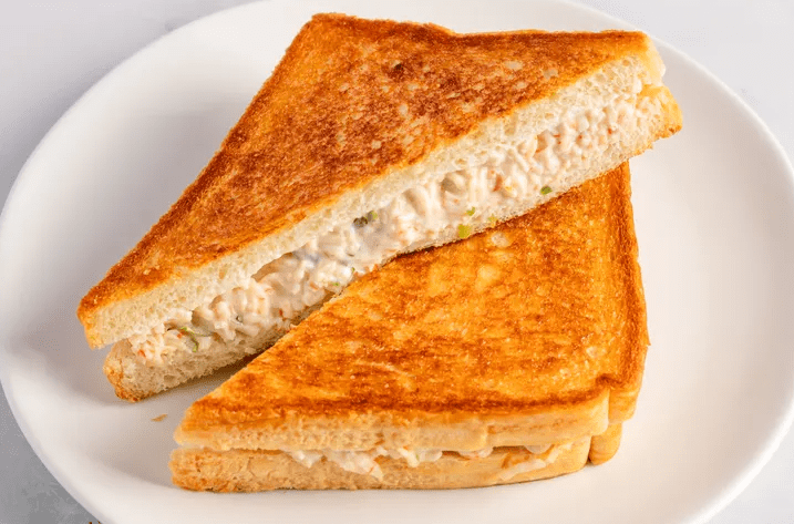 Platter of crab Rangoon sandwich halves, ready to serve