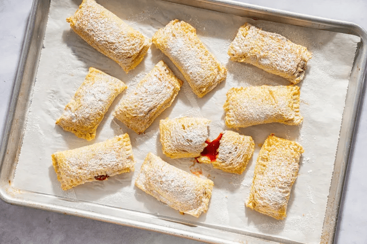 Freshly baked toast pies cooling on a wire rack after coming out of the oven