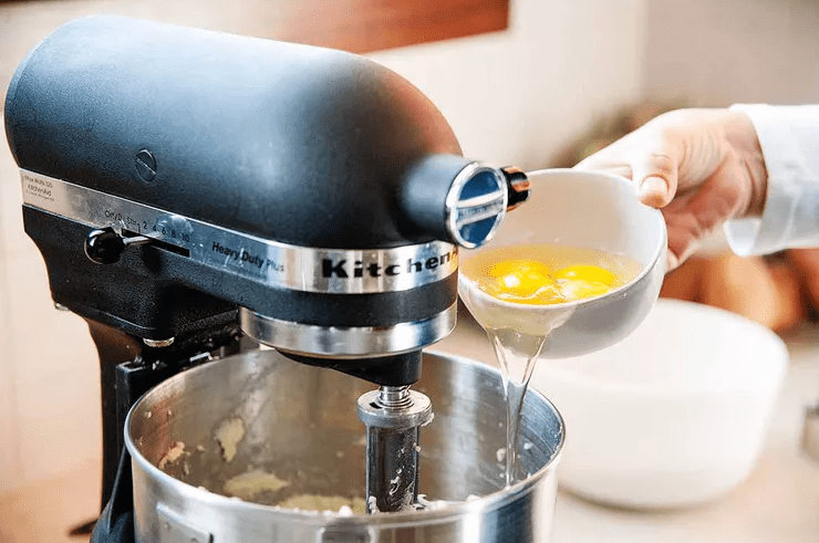 Adding eggs in the batter mix