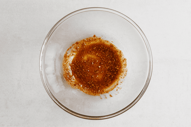 Olive oil mixed with seasonings for chicken breast